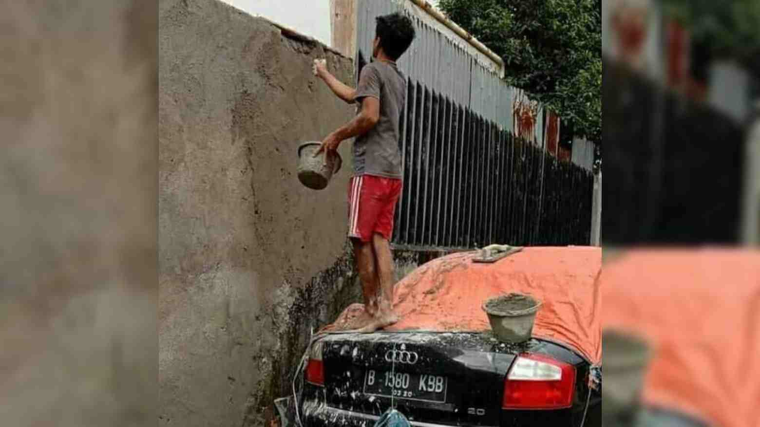 Viral: Buruh Bangunan Plaster Tembok Bepijak di Atas Mobil Mewah